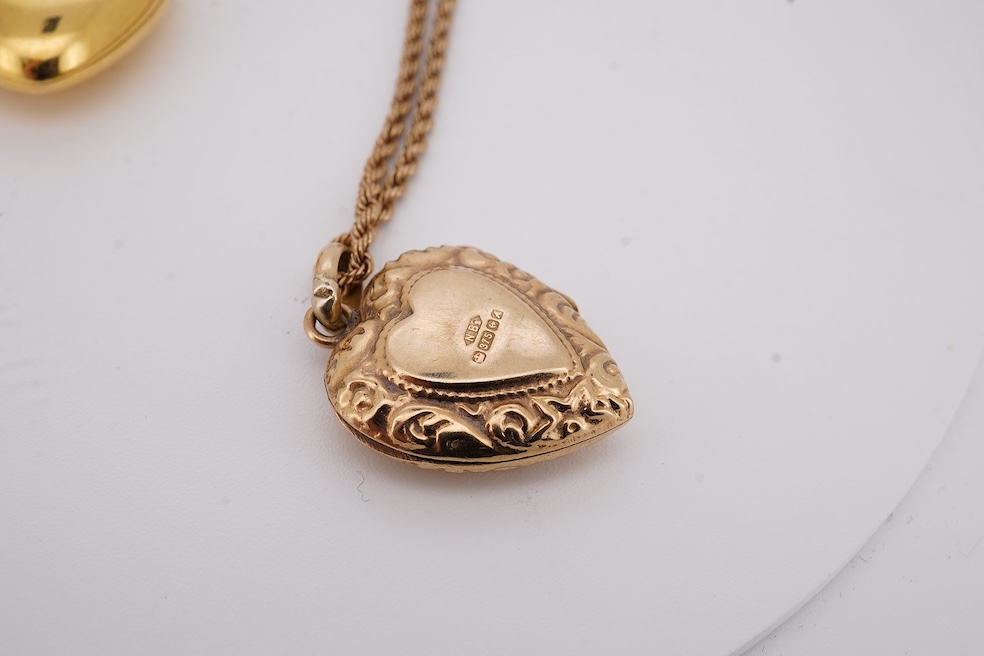 A modern embossed 9ct gold heart shaped locket, 21mm, on a similar 9ct gold rope twist chain, 46cm, together with one other yellow metal heart shaped locket, on a yellow metal chain, gross weight 14.5 grams. Condition -